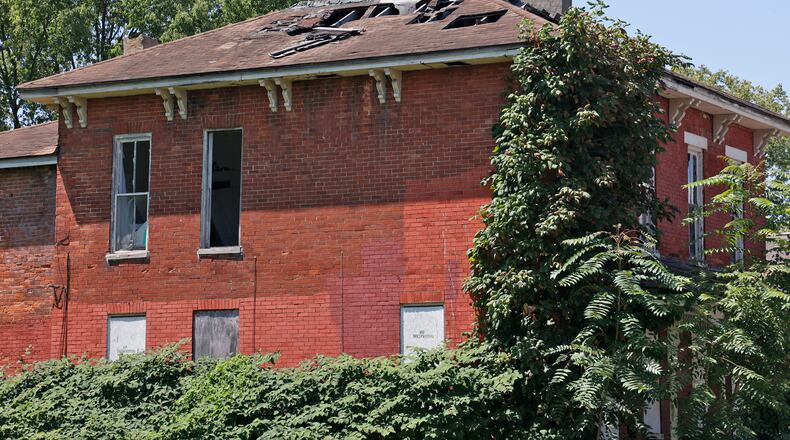 An abandoned house in Springfield Tuesday, August 8, 2023. BILL LACKEY/STAFF