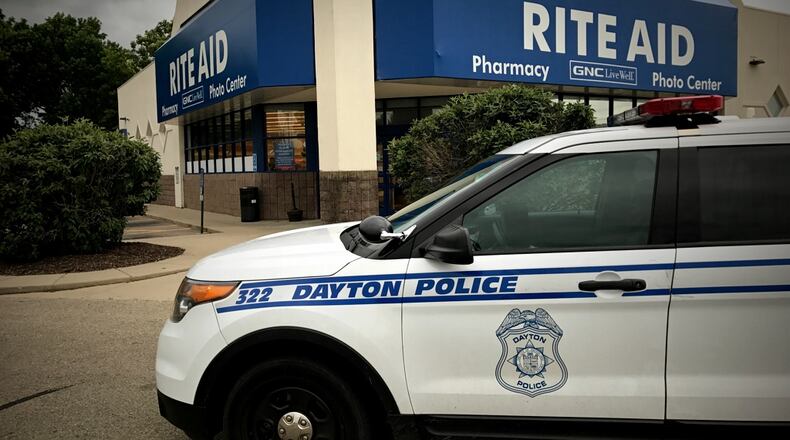Dayton police responded to a robbery June 7, 2017, at Rite Aid on Linden Avenue. JIM NOELKER / STAFF