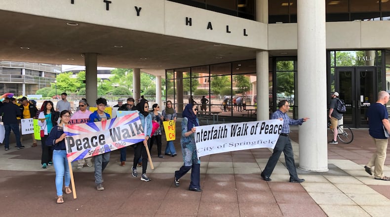 About 60 people of different faiths, races and lifestyles participated in the annual Interfaith Peace Walk that marched from City Hall to the Gammon House for the 2019 Juneteenth and FatherFest events. Photo by Brett Turner