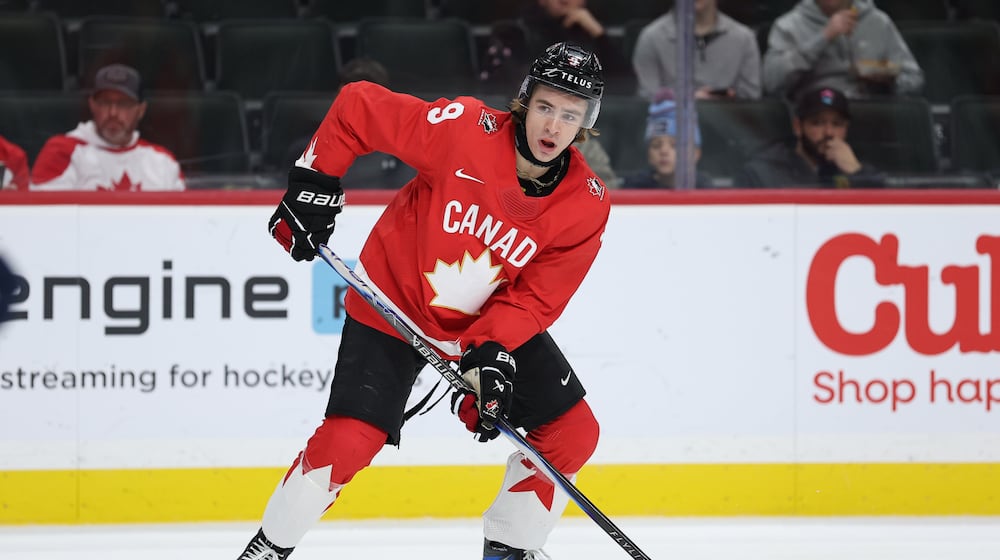 Canada forward Gavin McKenna (9) controls the puck during the second period of an IIHF World Junior Hockey Championship bronze medal game against Finland, Monday, Jan. 5, 2026, in St. Paul, Minn. (AP Photo/Matt Krohn)