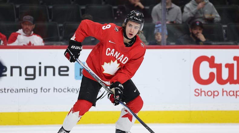 Canada forward Gavin McKenna (9) controls the puck during the second period of an IIHF World Junior Hockey Championship bronze medal game against Finland, Monday, Jan. 5, 2026, in St. Paul, Minn. (AP Photo/Matt Krohn)