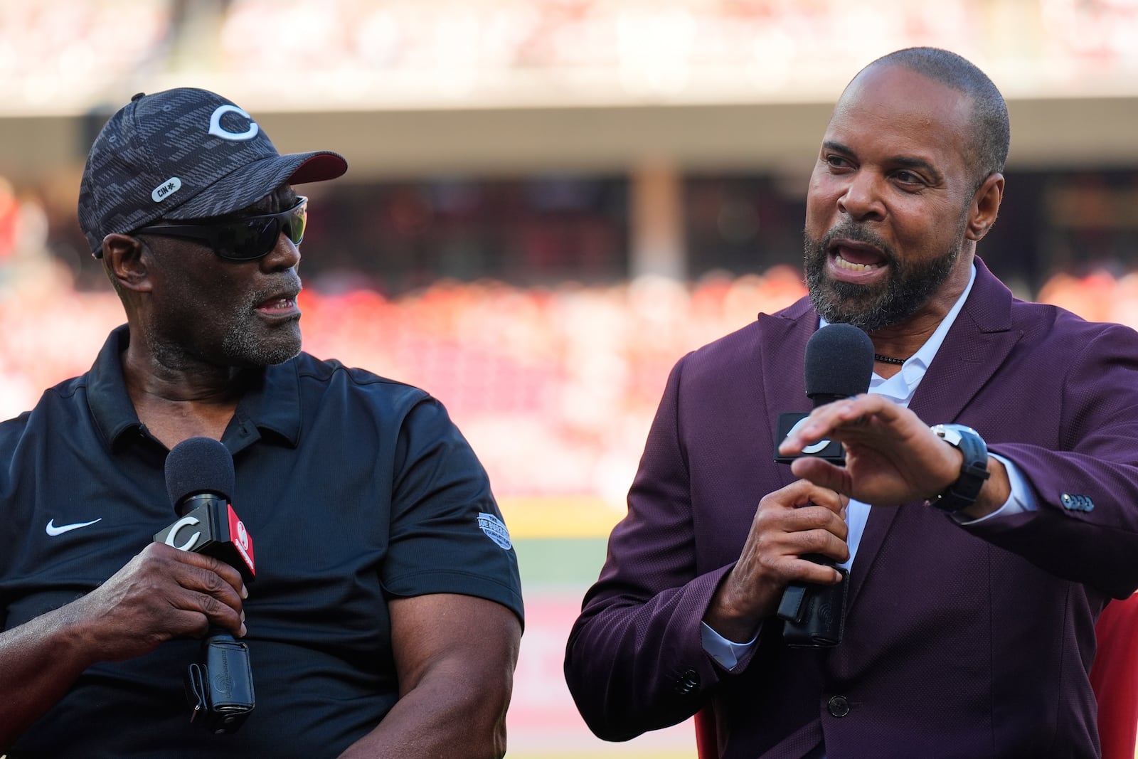 Cincinnati Reds Hall of Fame players George Foster, left, and Barry Larkin participate in Pete Rose Night events before a baseball game between the Cincinnati Reds and the Chicago White Sox, Wednesday, May 14, 2025, in Cincinnati. (AP Photo/Carolyn Kaster)