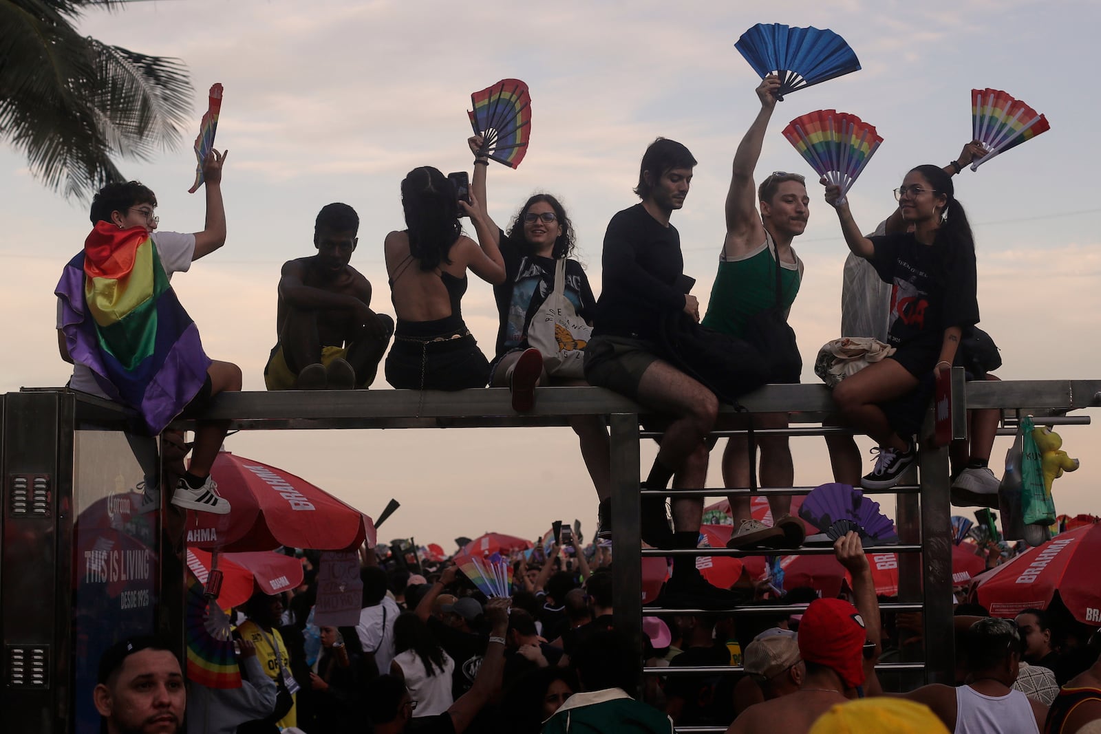 Fans cheer as they wait for the start of Lady Gaga's free concert on Copacabana beach in Rio de Janeiro, Saturday, May 3, 2025. (AP Photo/Bruna Prado)