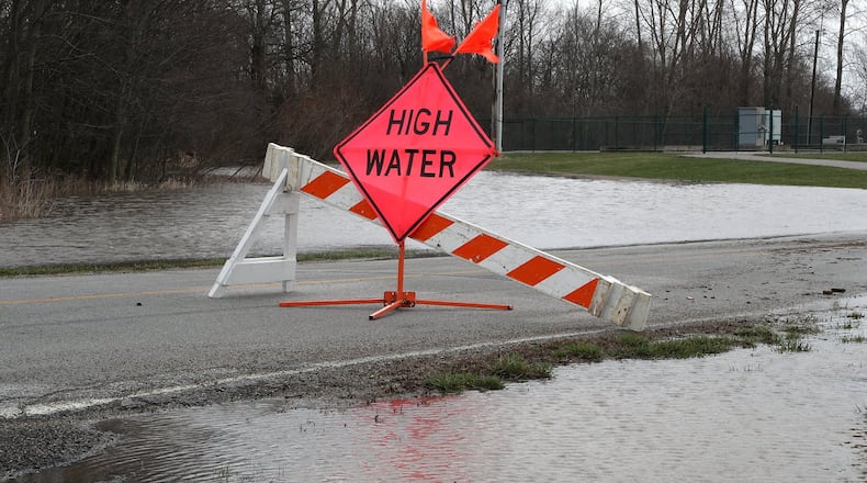 A high water sign surrounded by water on Mitchell Road in Clark County. BILL LACKEY/STAFF
