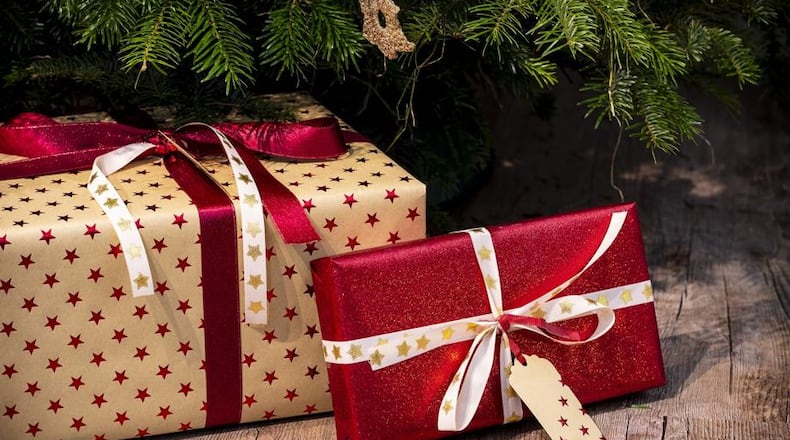Photo illustration of gifts under a Christmas tree. CONTRIBUTED