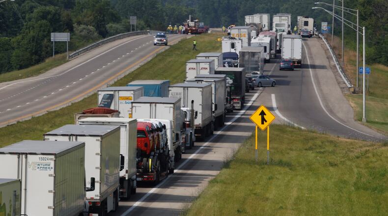 Traffic on U.S. 68 south was backed up after downed power lines blocked the roadway Thursday, June 20, 2024. BILL LACKEY/STAFF
