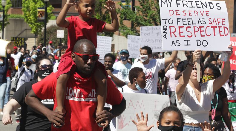 Hundreds of demonstrators marched through the streets of Springfield in the end of May to protest racial injustices occurring in the country. BILL LACKEY/STAFF
