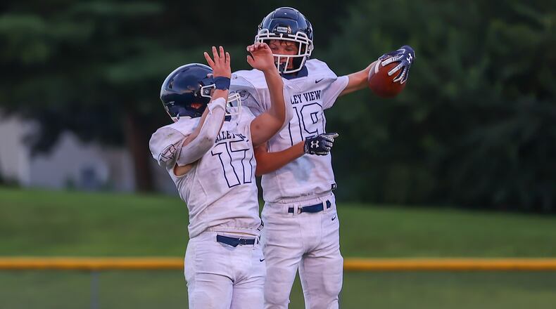 Cutline 3: Valley View High School junior Troy Hypes (right) celebrates with junior Cade Sears after scoring a touchdown during their game against Shawnee on Friday night in Springfield. The Spartans won 25-7. CONTRIBUTED PHOTO BY MICHAEL COOPER