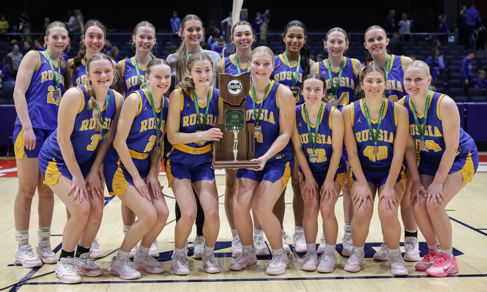 Russia players pose for a team photo following a 38-17 loss to Strasburg-Franklin in the Division VII state final on Saturday, March 14 at University of Dayton Arena. BRYANT BILLING / STAFF
