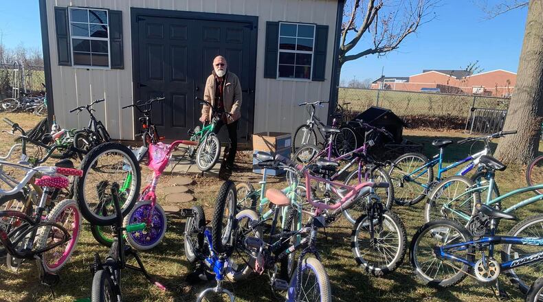 David Nugent with a few of the bikes he has repaired and that are ready for children to ride.