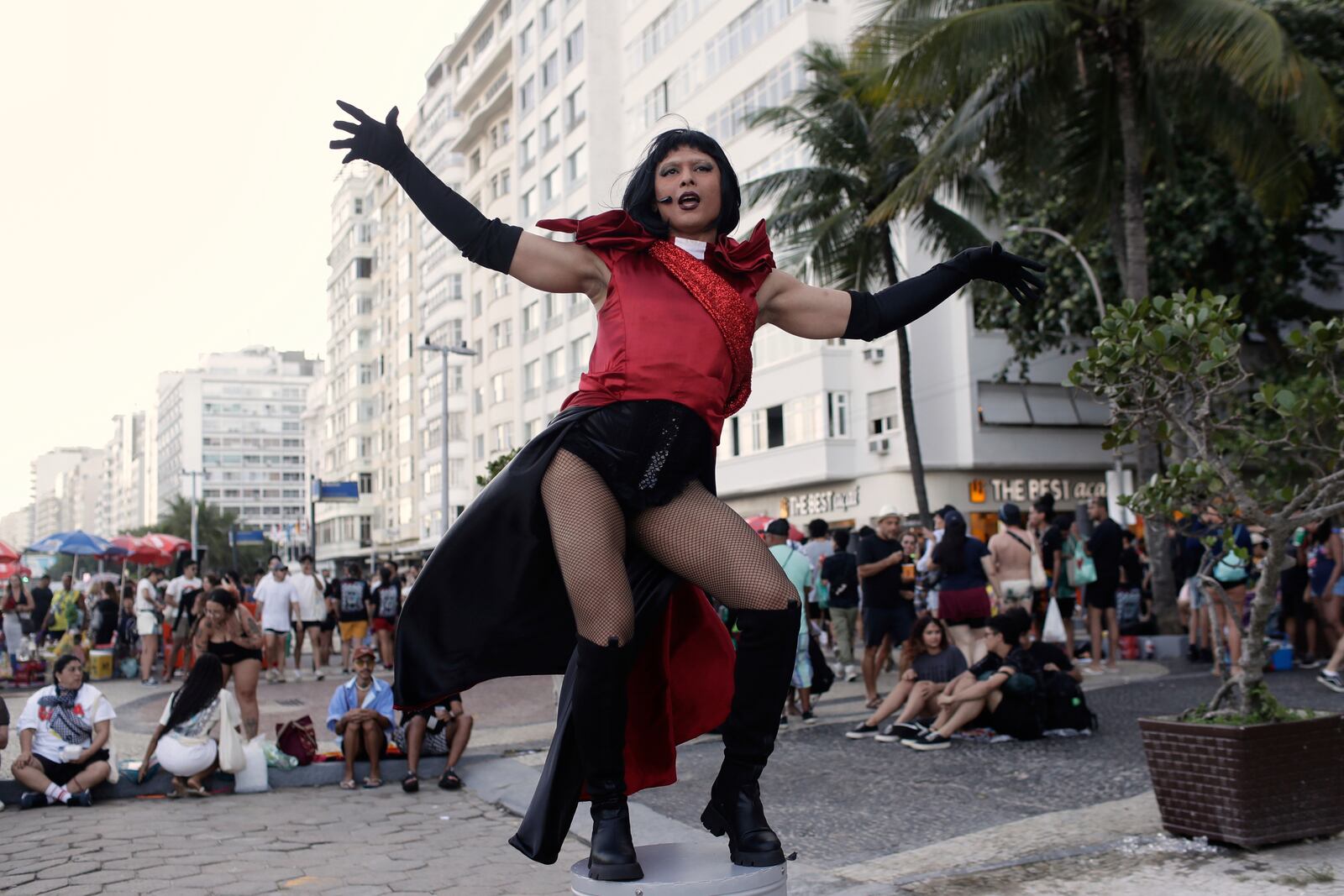 A fan strikes a pose as she waits for the start of Lady Gaga's free concert on Copacabana beach in Rio de Janeiro, Saturday, May 3, 2025. (AP Photo/Bruna Prado)
