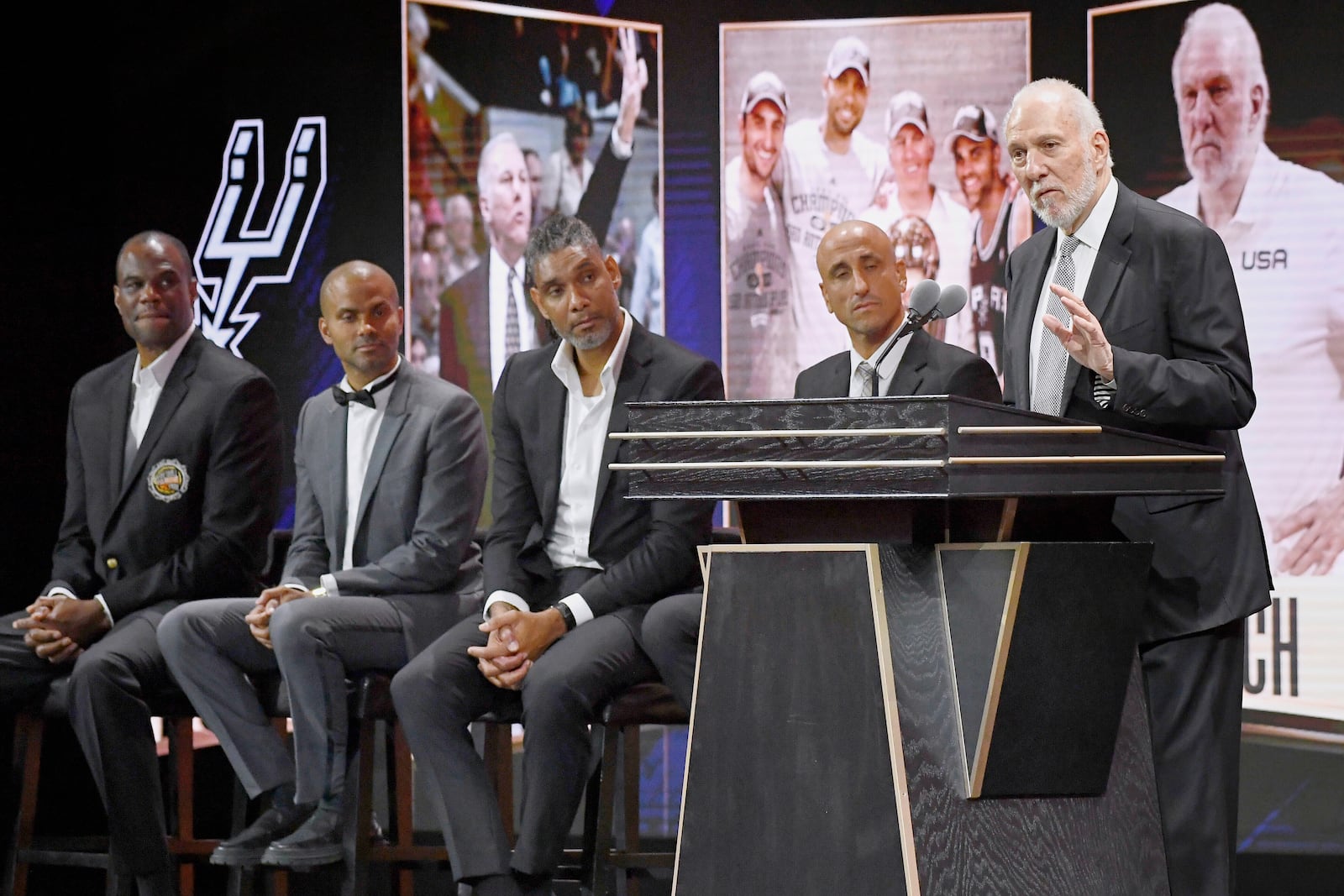 FILE - Gregg Popovich speaks during his enshrinement at the Basketball Hall of Fame as presenters David Robinson, Tony Parker, Tim Duncan and Manu Ginobili, from left, listen Saturday, Aug. 12, 2023, in Springfield, Mass. (AP Photo/Jessica Hill, File)