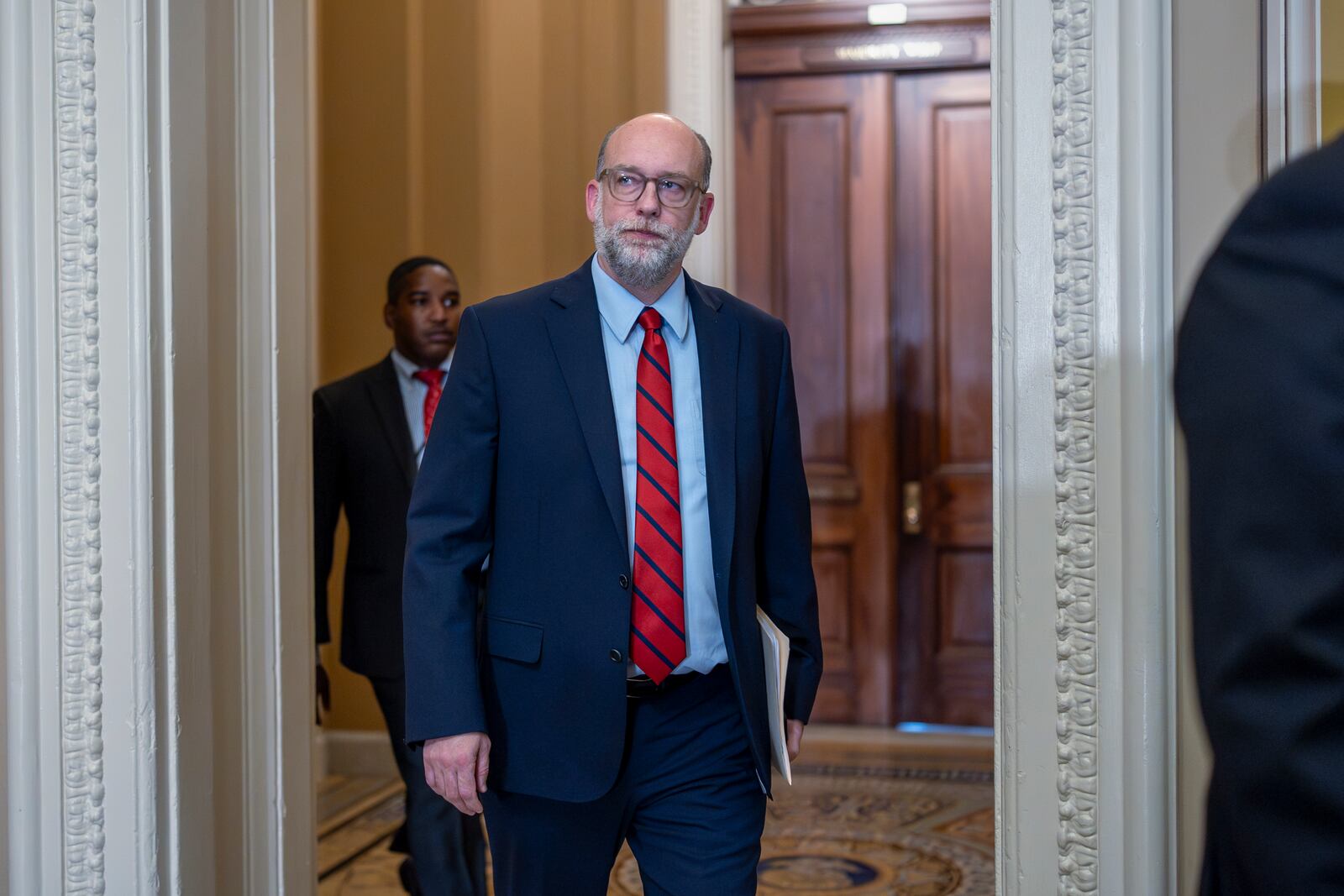 Office of Management and Budget Director Russell Vought, who's charged with implementing President Donald Trump's policies and agendas, arrives to meet with Republican senators at the Capitol in Washington, Tuesday, July 15, 2025. (AP Photo/J. Scott Applewhite)