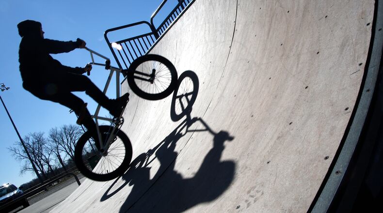 Damien Cameron takes advantage of the unseasonably warm weather and bright sunshine to get in some BMX freestyle practice on the Springfield Skate Park Tuesday, Feb. 20, 2024. BILL LACKEY/STAFF