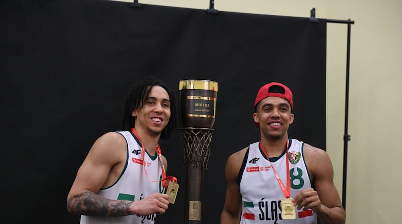 Travis Trice, left, and D'Mitrik Trice pose for a photo with the championship trophy after helping lead WKS Śląsk Wrocław to a championship in Poland. Photo courtesy of WKS Śląsk Wrocław