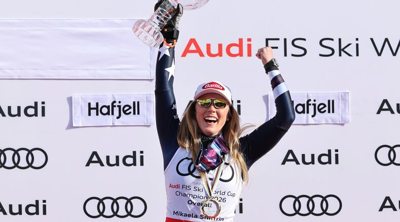 United States' Mikaela Shiffrin celebrates winning the women's overall World Cup skiing title, at the Lillehammer World Cup Finals, in Hafjell, Norway, Wednesday, March 25, 2026. (AP Photo/Marco Trovati)