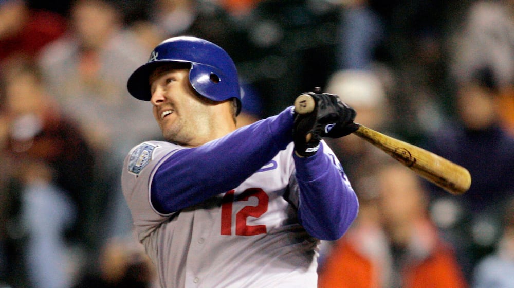 FILE - Los Angeles Dodgers Jeff Kent hits a two-run home run against the San Francisco Giants in the fourth inning of a baseball game in San Francisco, Sept. 26, 2008. (AP Photo/Jeff Chiu, File)