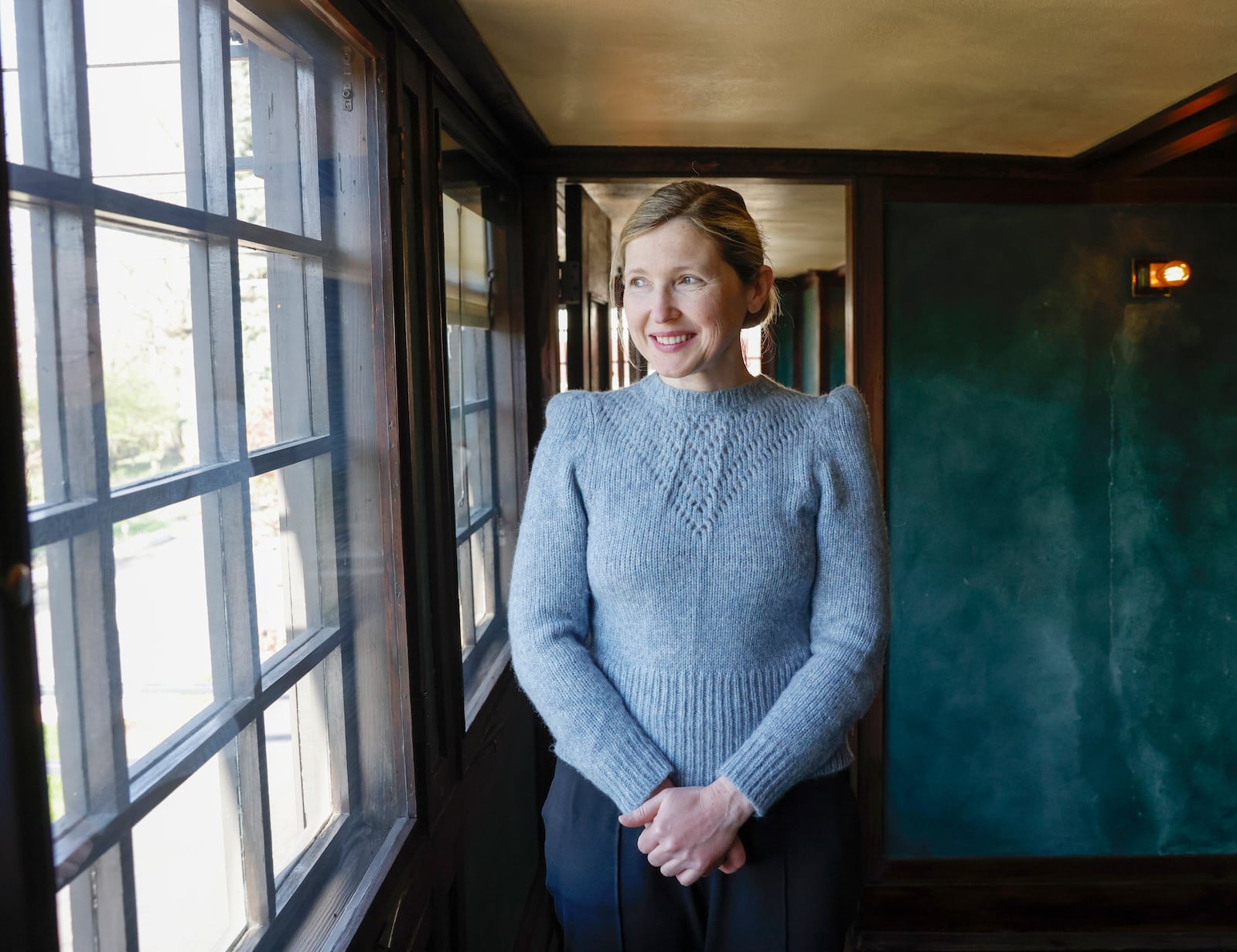 Executive director and curator Marta Wojcik in a bedroom of Frank Lloyd Wright's Westcott House on Thursday, April 17, 2025. JOSEPH COOKE/STAFF