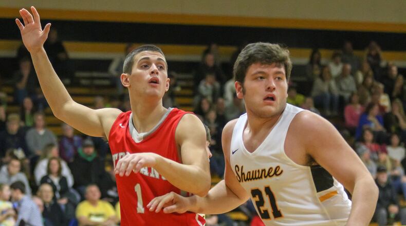 Southeastern High School senior Charlie Bertemes calls for the ball against Shawnee’s D.J. Hayden during their game in Springfield on Dec. 7. The Braves won 42-39. CONTRIBUTED PHOTO BY MICHAEL COOPER