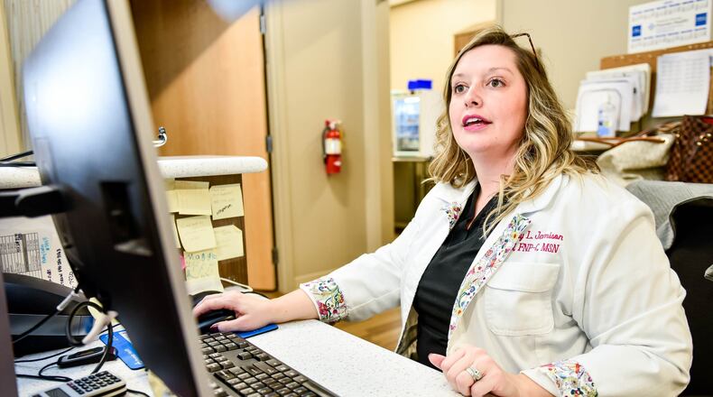 Family Nurse Practitioner Brittany Jamison works at the computer between seeing patients at Premier Health Urgent Care on N. Main Street in Springboro Wednesday, Feb. 29, 2020. NICK GRAHAM / STAFF