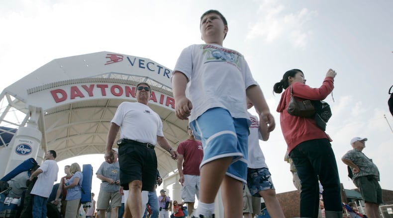 Air Show fans enjoyed touring the displays in 2008 at the Vectren Dayton Air Show after coming through the main entrance. STAFF PHOTO BY TY GREENLEES