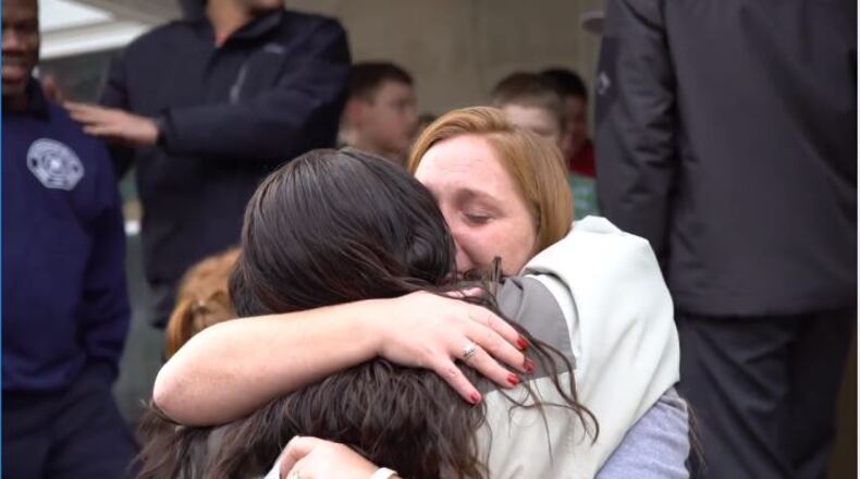 A Springfield woman expresses her thanks after receiving gifts from LWS Tax & Accounting during their annual Christmas give back.