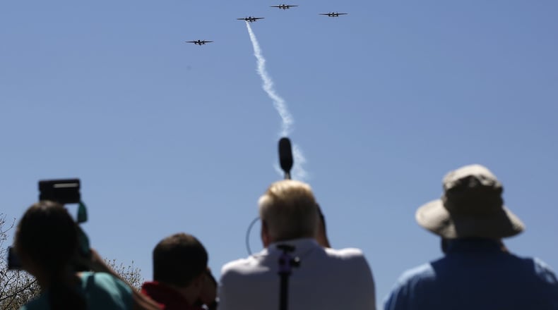 Photographers follow the B-25 Missing Man formation salute to the Doolittle Tokyo Raiders in April 2017. The National Museum of the United States Air Force marked the 75th anniversary of the World War II mission against Japan. Of the 80 Raiders, Dayton native Lt. Col. Richard E. Cole is the last survivor and attended the ceremonies. TY GREENLEES / STAFF FILE PHOTO