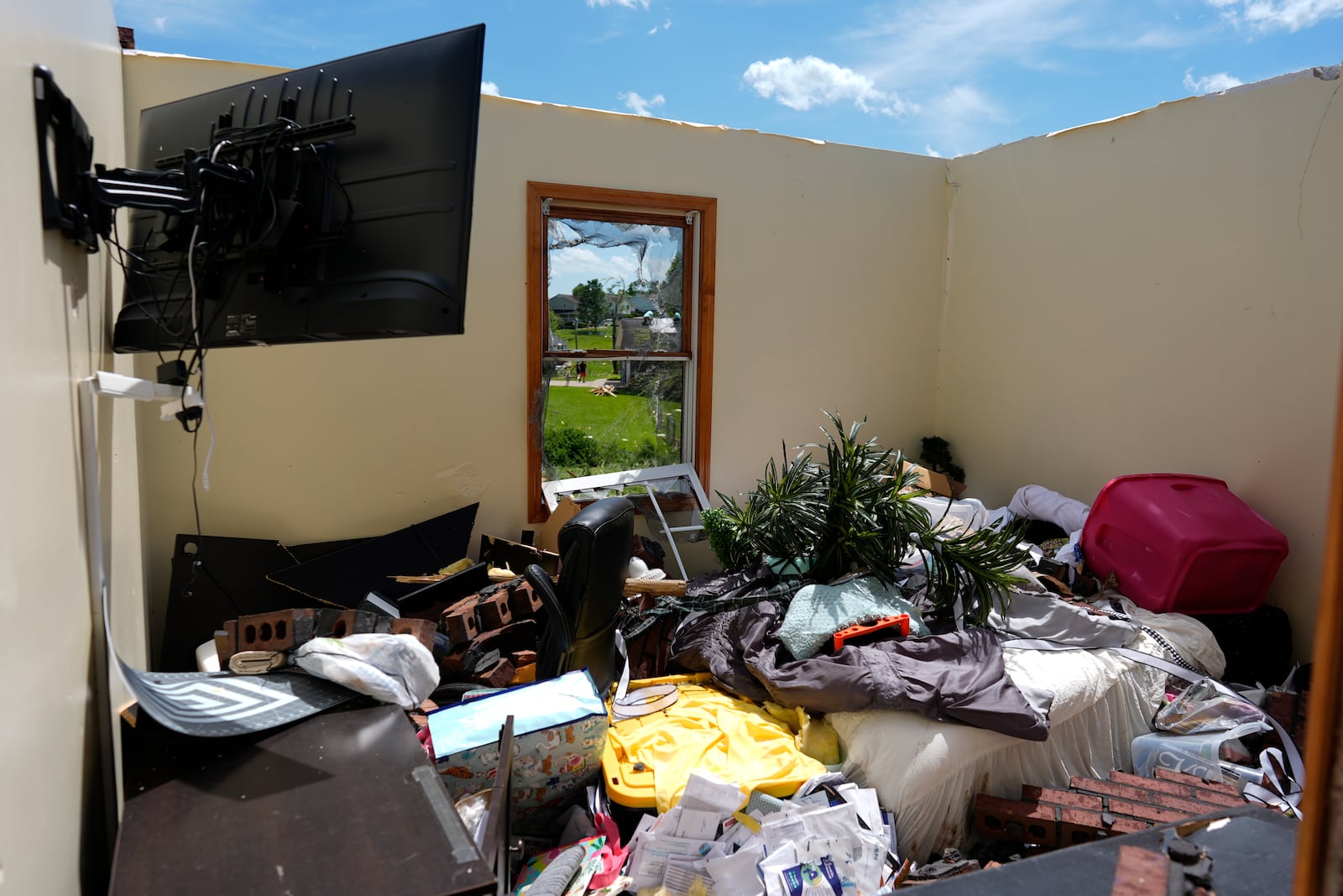 A home is destroyed after a severe storm passed the area on Saturday, May 17, 2025 in London, Ky. (AP Photo/Carolyn Kaster)