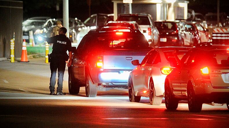 A line of cars waits to enter a Wright-Patterson Air Force Base gate in this 2021 file photo. (Marshall Gorby/Staff)