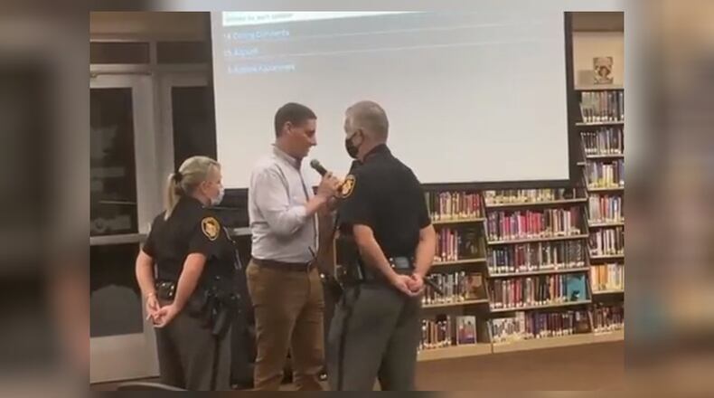 U.S. Senate candidate Josh Mandel was asked to leave the Oct. 11, 2021, school board meeting after he questioned the board on its mask mandate policy. The board cited Mandel was not a resident of the district. Residents or designees of residents are permitted to speak, according to the district. A woman said she designated Mandel to speak on her behalf, but the board said she "yielded" her time and did not formally designate him. SCREEN CAPTURE/TWITTER.COM/JOSHMANDELOHIO