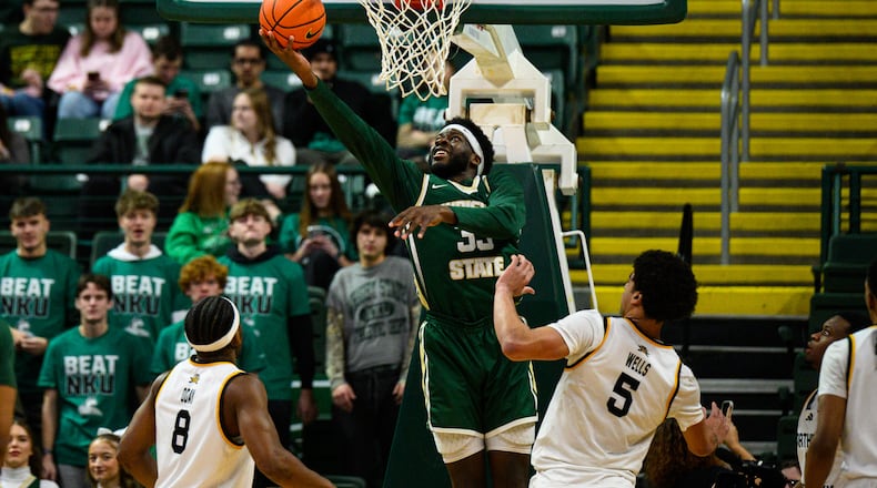 Wright State University's Michael Imariagbe shoots the ball between two Northern Kentucky University defenders during their game on Saturday, Jan. 24, 2026. JEREMY MILLER / CONTRIBUTED PHOTO