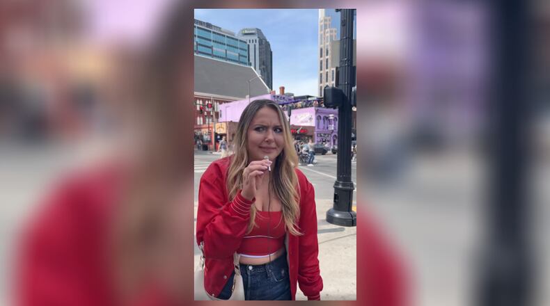 A woman on Broadway in Nashville calls the Cincinnati Bengals the "Boston Bobcats." SCREEN/CONTRIBUTED