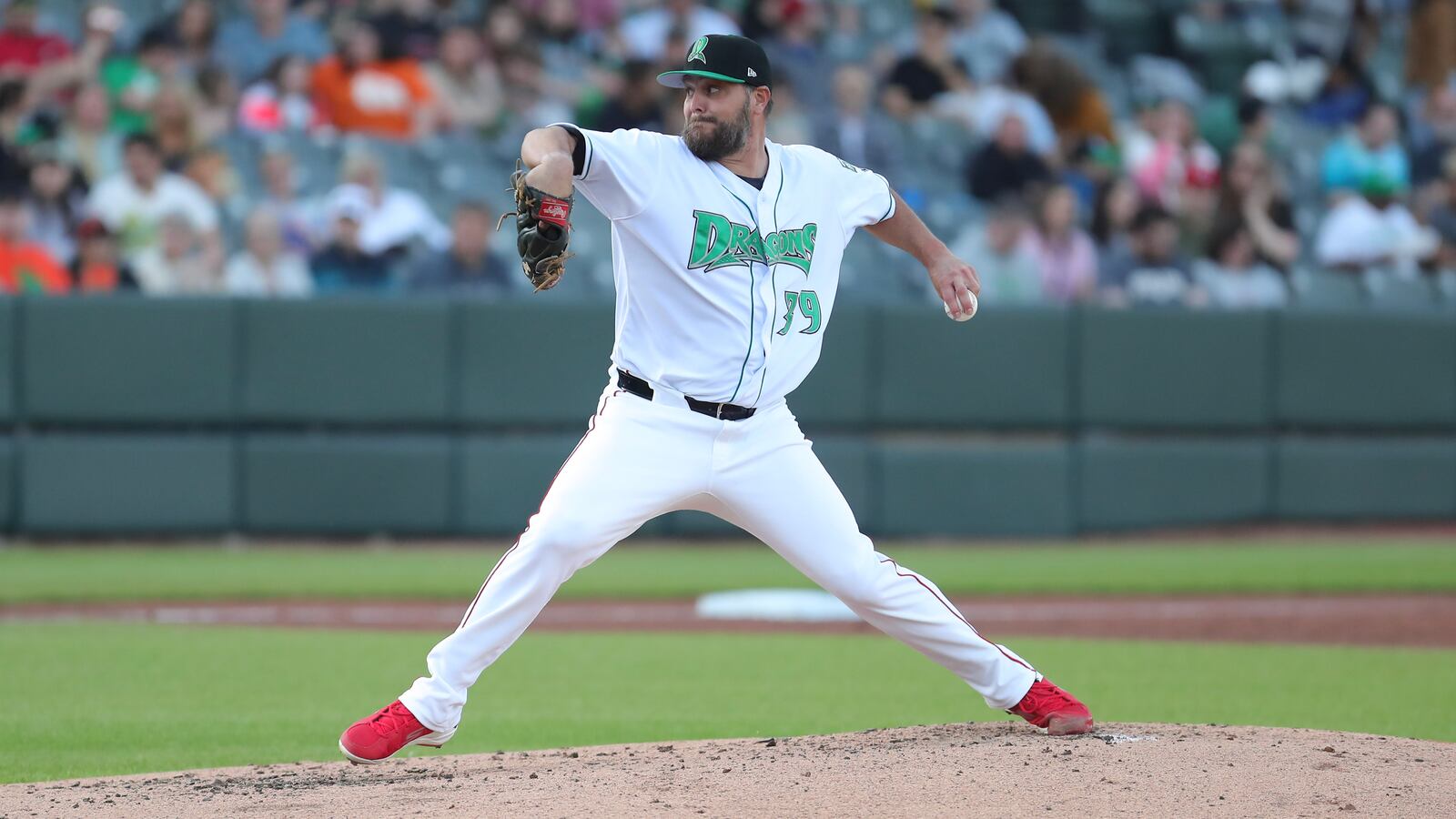 Cincinnati Reds pitcher Wade Miley delivers a pitch for the Dayton Dragons during their game against the West Michigan Whitecaps on Tuesday night at Day Air Ballpark. Miley is with the team on a rehab assignment. Michael Cooper/STAFF