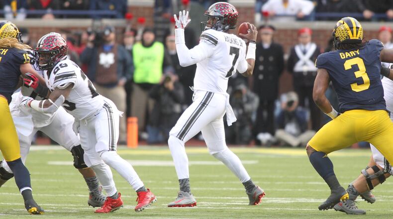 Ohio State’s Dwayne Haskins throws a 27-yard pass to Austin Mack in the third quarter against Michigan on Saturday, Nov. 25, 2017, at Michigan Stadium in Ann Arbor, Mich. David Jablonski/Staff