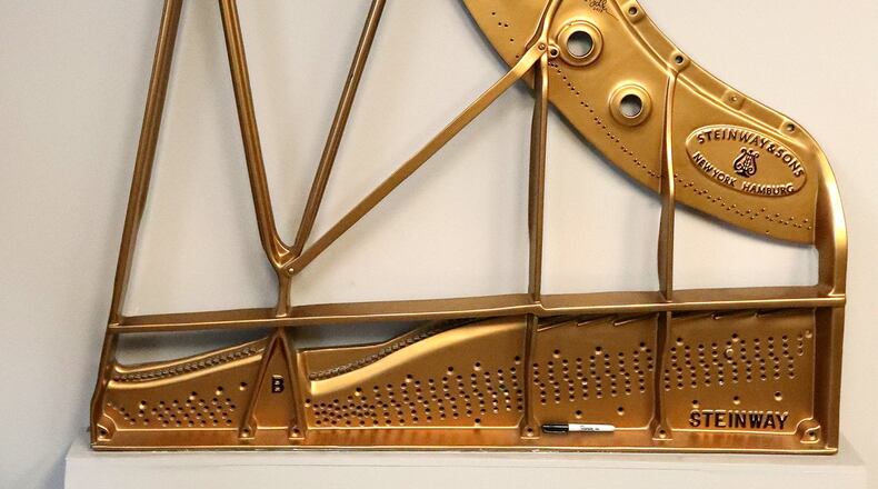 The harp plate for a Steinway and Sons piano, made in Springfield at the OS Kelly Company. BILL LACKEY/STAFF