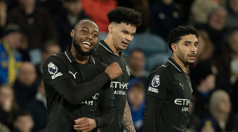 Manchester City's Antoine Semenyo, left, reacts after scoring during the Premier League soccer match between Leeds United and Manchester City in Leeds, England, Saturday, Feb. 28, 2026. (AP Photo/Ian Hodgson)