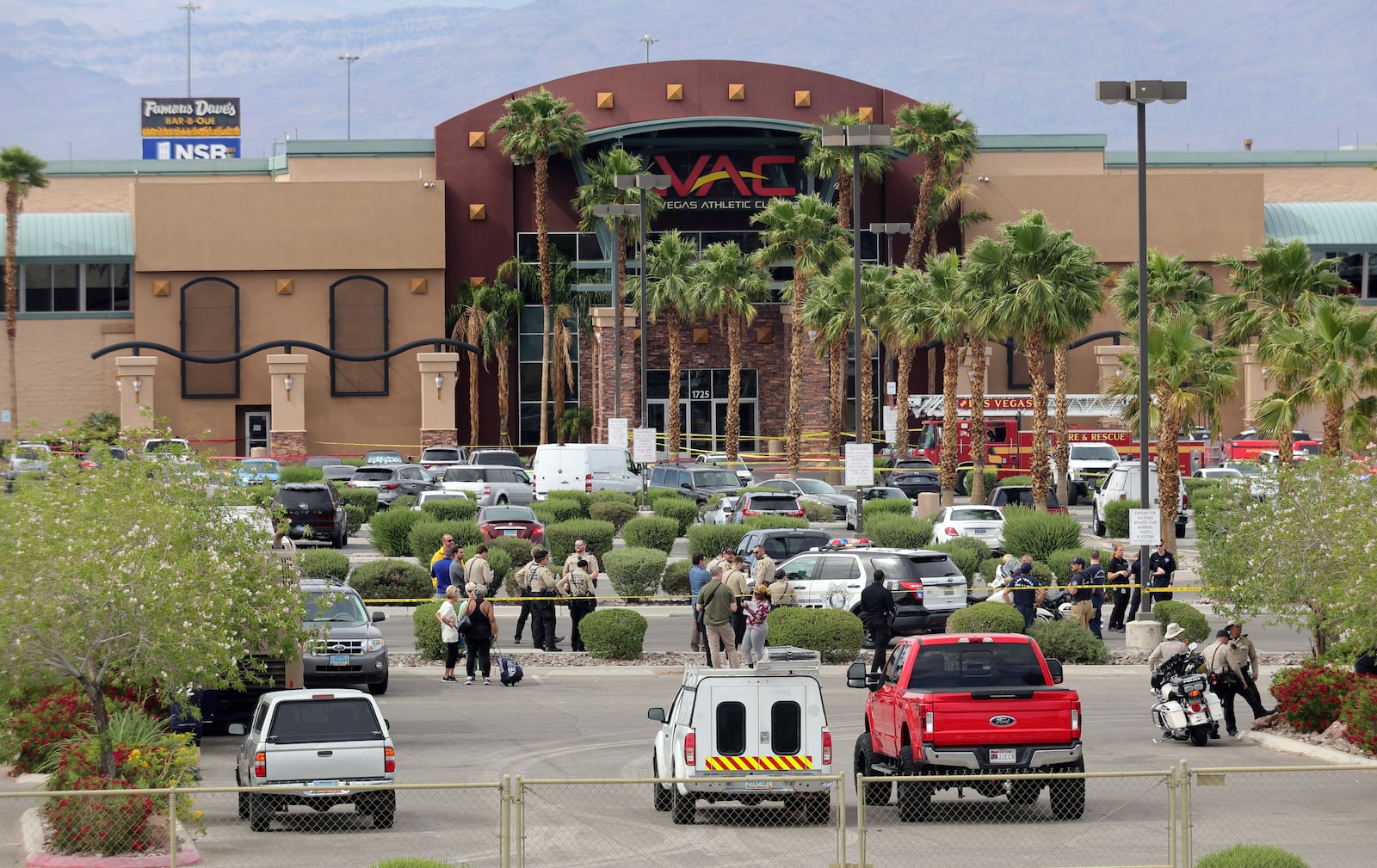 Las Vegas Metro Police officers are shown in front of a Las Vegas Athletic Club after a shooting Friday, May 16, 2025, in Las Vegas. (Steve Marcus/Las Vegas Sun via AP)