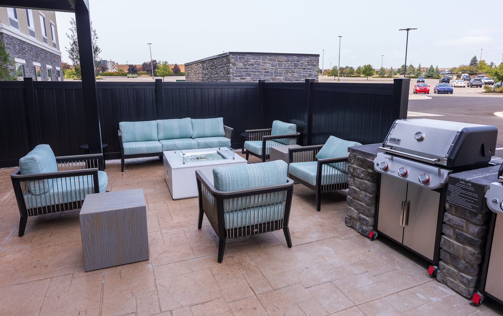 A view of a outdoor area with a fire pit and grills at Fairfield Inn and Suites and TownePlace Suites next to Mall at Fairfield Commons in Beavercreek. The hotel celebrated its opening on Friday, Sept. 5. BRYANT BILLING / STAFF