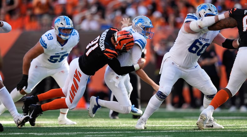 Cincinnati Bengals defensive end Trey Hendrickson (91) causes Detroit Lions quarterback Jared Goff (16) to fumble during the first half of an NFL football game Sunday, Oct. 5, 2025, in Cincinnati. (AP Photo/Carolyn Kaster)