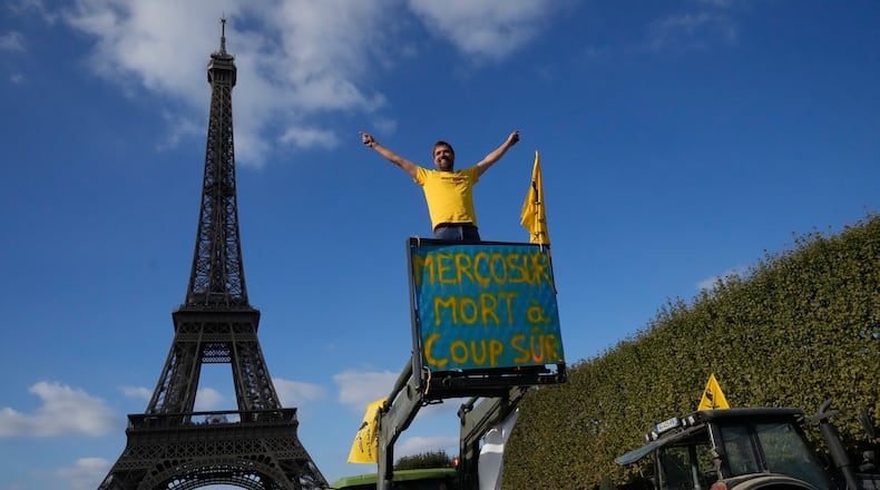 FILE - French farmers protest against the Mercosur trade alliance with South America countries, on Oct. 14, 2025 near the Eiffel Tower in Paris. (AP Photo/Michel Euler, File)