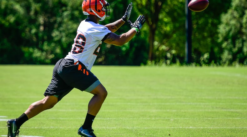 Cincinnati Bengals running back Joe Mixon catches the ball during practice Tuesday, June 6 on their practice fields next to Paul Brown Stadium in Cincinnati. NICK GRAHAM/STAFF