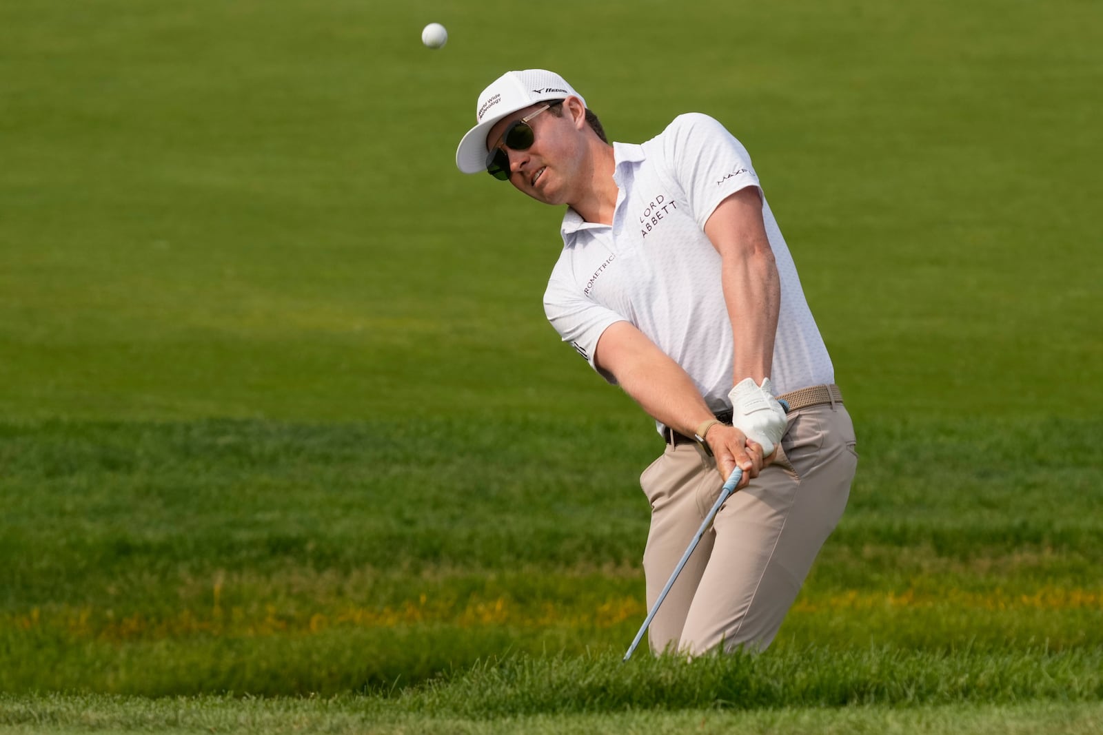 Ben Griffin chips onto the ninth green during the third round of the Memorial golf tournament Saturday, May 31, 2025, in Dublin, Ohio. (AP Photo/Sue Ogrocki)