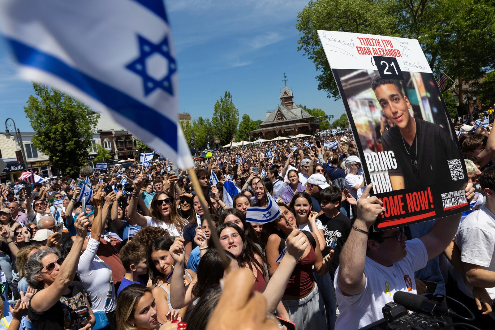 People gathered in Huyler Park celebrate the release of American hostage Edan Alexander from Hamas on Monday, May 12, 2025 in Tenafly, N.J. (AP Photo/Stefan Jeremiah)