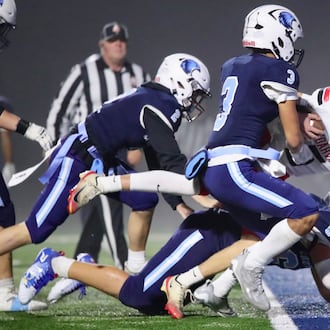 Cedarville High School senior quarterback Will Mossing barrels through three Cincinnati Country Day defenders into the end zone during their Division VII, Region 28 quarterfinal game on Friday night at the Brian J. Bortz Family Stadium in Indian Hill. The Indians won 49-21. CONTRIBUTED PHOTO