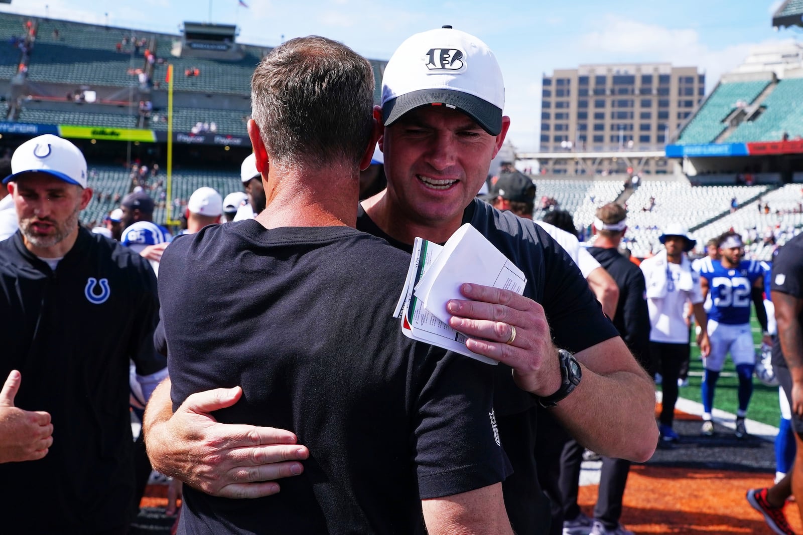 Cincinnati Bengals head coach Zac Taylor, right, hugs Indianapolis Colts defensive coordinator Lou Anarumo following a preseason NFL football game, Saturday, Aug. 23, 2025, in Cincinnati. (AP Photo/Jeff Dean)