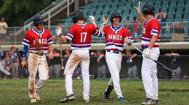 Cutline: Champion City Kings infielder Ben Ross (second from right) celebrates with teammates after scoring during their 13-5 victory over the Danville Dans on Wednesday, July 28. Ross recently set the Kings record for hits in a season. CONTRIBUTED PHOTO BY MICHAEL COOPER