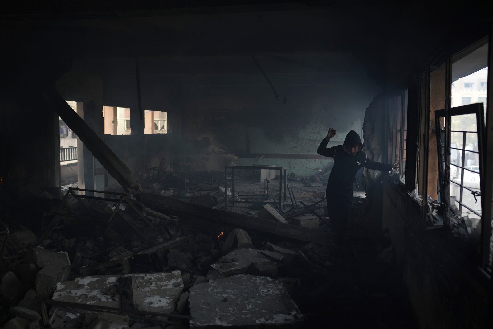Palestinians inspect the damage after an Israeli airstrike early this morning on Yaffa School, in Gaza City, Wednesday, April 23, 2025. (AP Photo/Jehad Alshrafi)