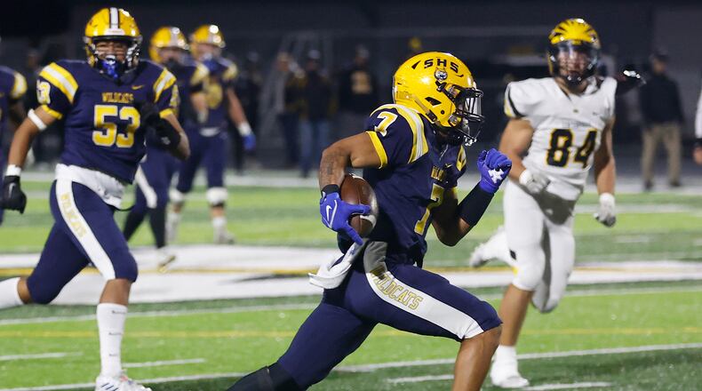 Springfield's Anthony Brown rushes for a Wildcats' touchdown against Centerville during Friday's playoff game. BILL LACKEY/STAFF