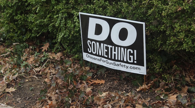 Six months after a 24-year-old Bellbrook man killed nine people in the Oregon District during the worst mass shooting in Ohio history, literal signs of strength, appreciation, resilience and the determination to “do something” about gun violence can be found throughout the historic neighborhood. "Do Something" signs are in several residential yards. AMELIA ROBINSON/STAFF