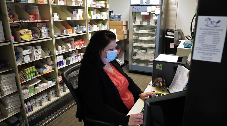 Rocking Horse Community Health Center received $75,000 from Community Health Foundation to fund an in-house pharmacy. Here, Dena Brown works in the Med Room a year ago at The Rocking Horse Center. BILL LACKEY/STAFF